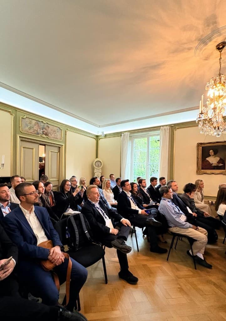 Delegates and audience in the embassy hall