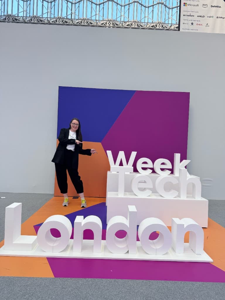 Viktoria Biki at the London Tech Week 2026 sign