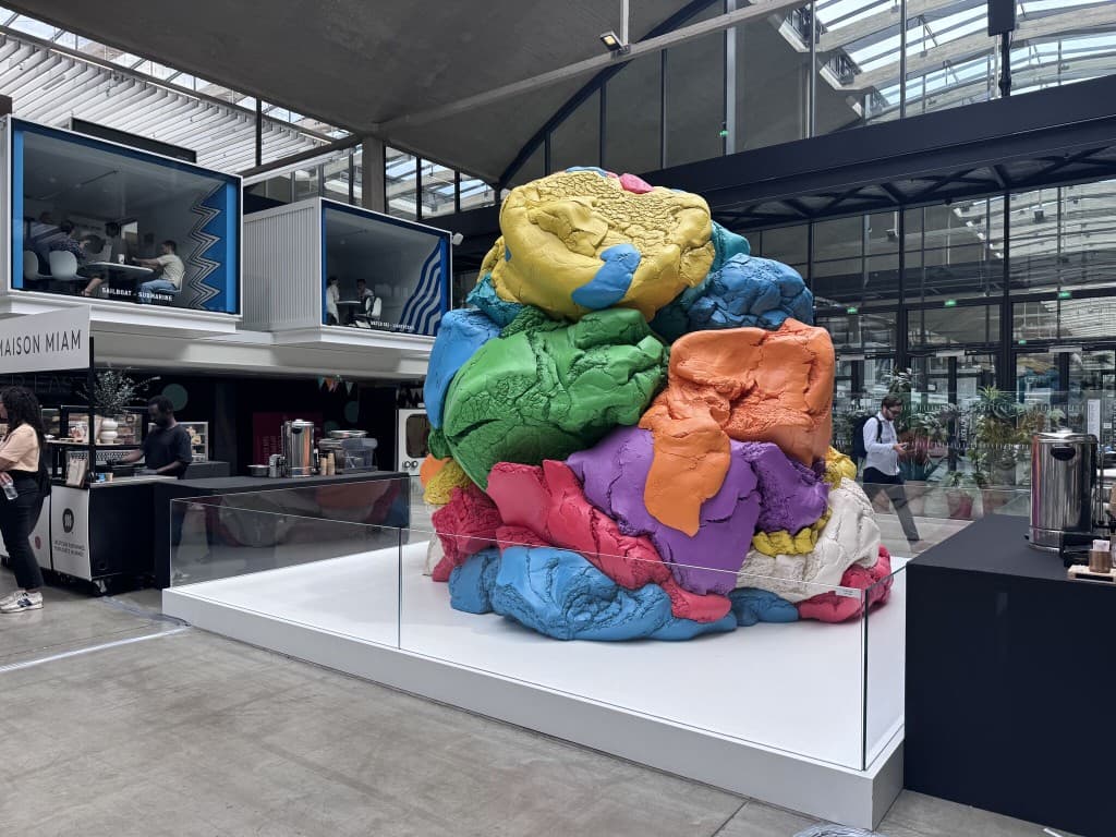 Station F hall with art installation and startup campus interior